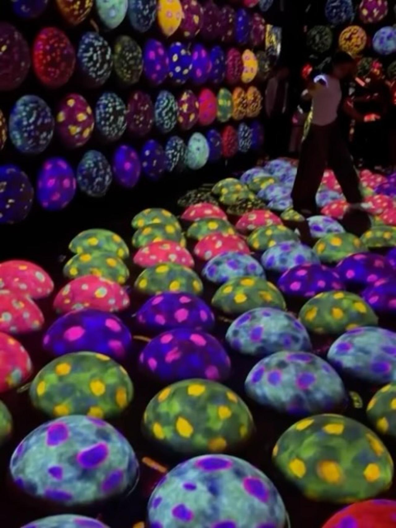 The carousel also features visuals from an immersive art installation filled with glowing, mushroom-like structures, as the actress is seen hopping onto each of them.